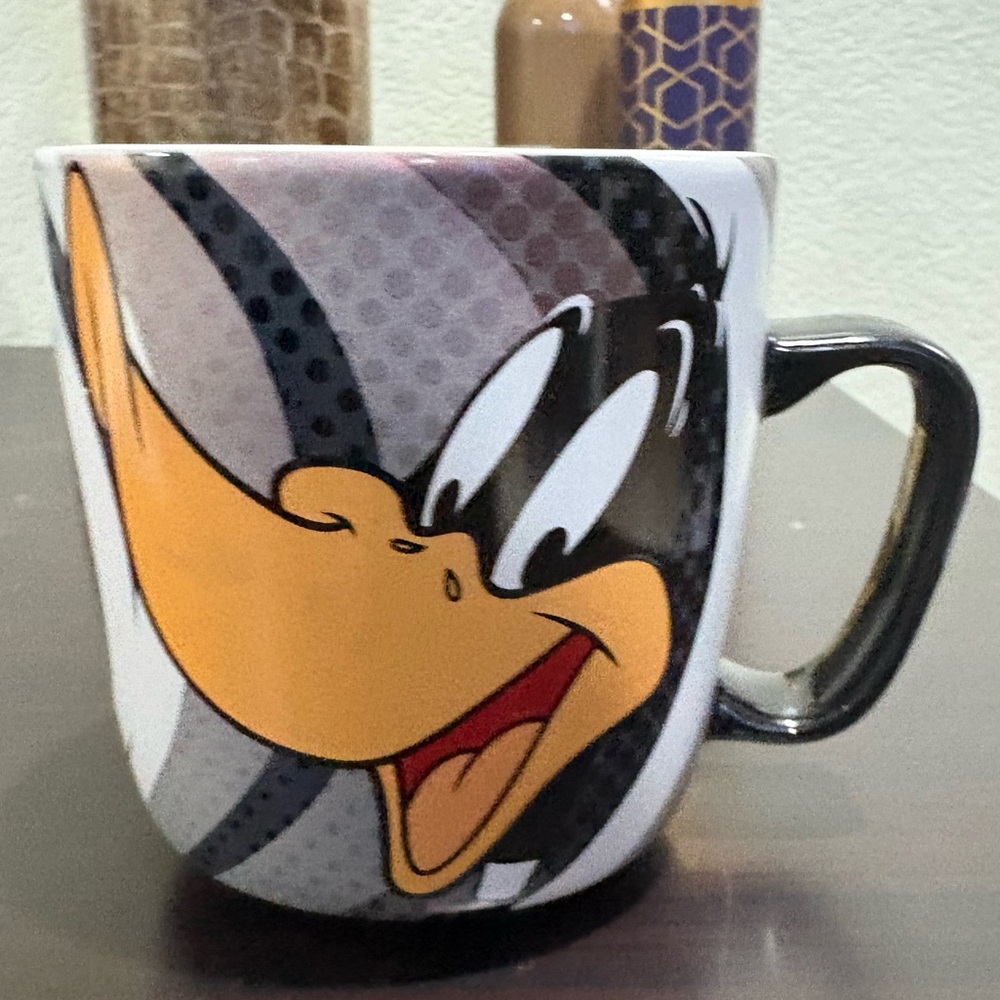 Warner Bros. Daffy Duck Mug with Black, White, and Orange Design